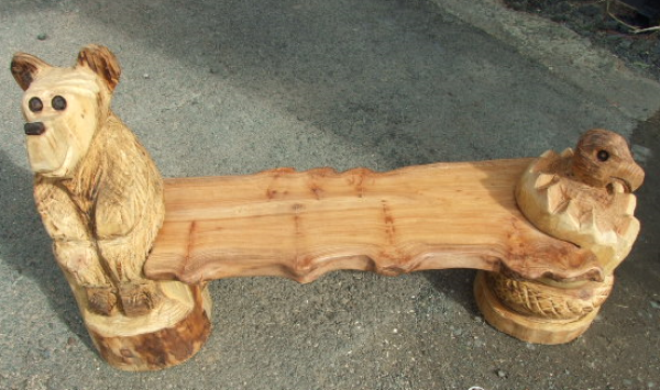 Teddy bear bench, carved by Manx chainsaw