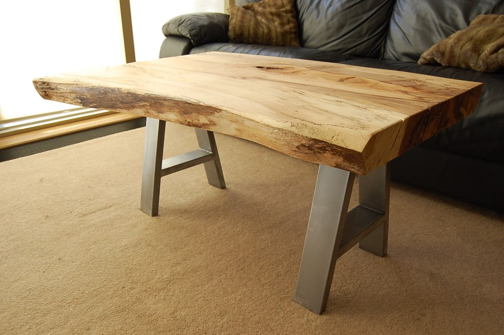Spalted beech live-edge wood slab sitting on industrial steel A-frame legs