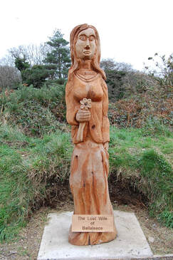 Giant Maiden chainsaw carving