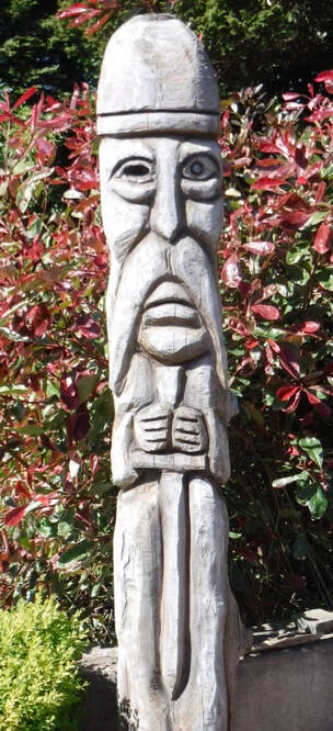 film prop carving of Odin god, wood sculpture garden